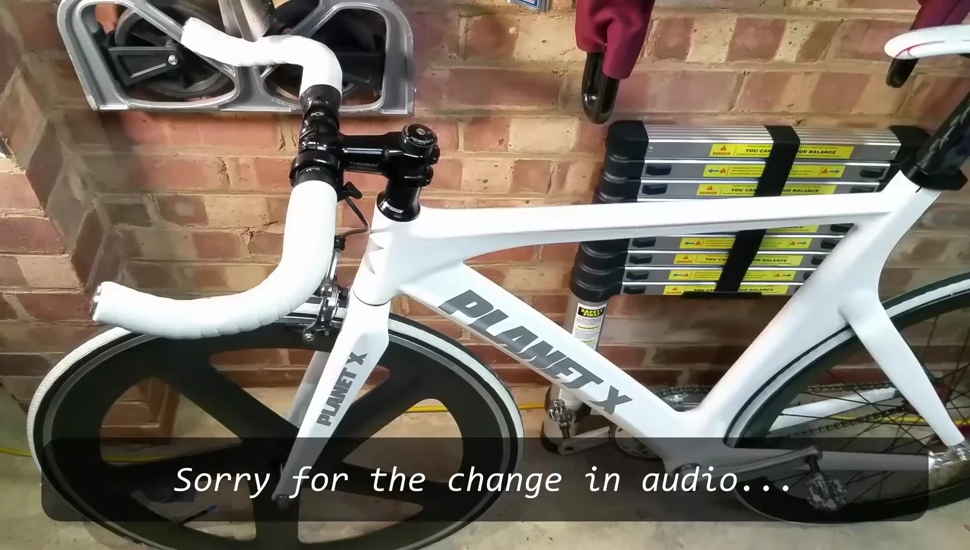 The Knog Oi bell mounted on the bicycle handlebars.