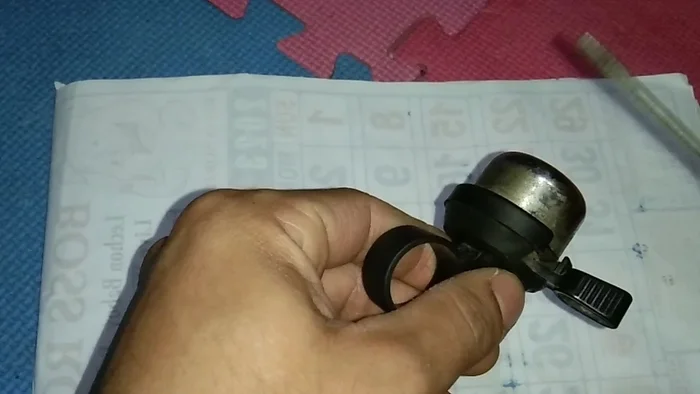 Carefully open the bell mechanism. Note that this particular bell doesn't have screws, it may need to be pulled apart.