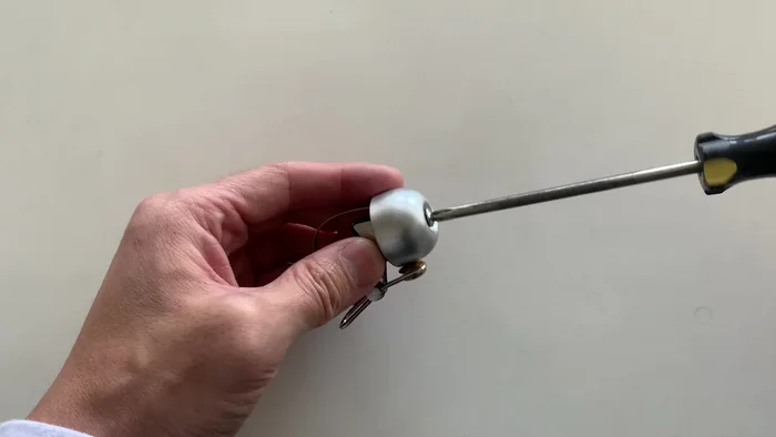 Remove the small rubber piece (don't lose it).