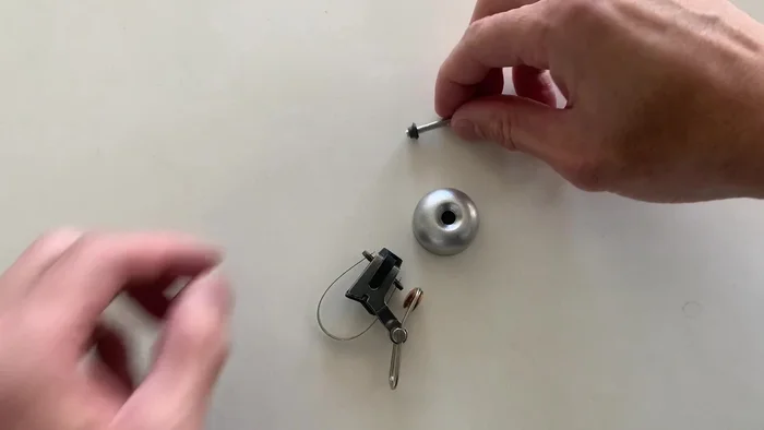 Remove the small rubber piece (don't lose it).