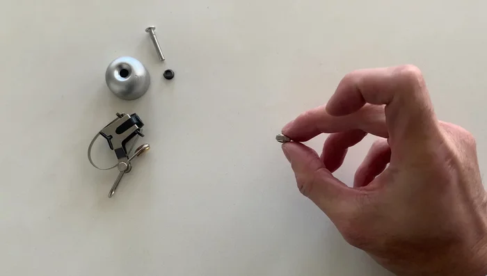 Place the cap back on and screw on the nuts, ensuring they are tight.