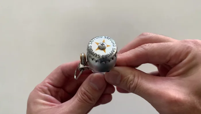 Place the cap back on and screw on the nuts, ensuring they are tight.