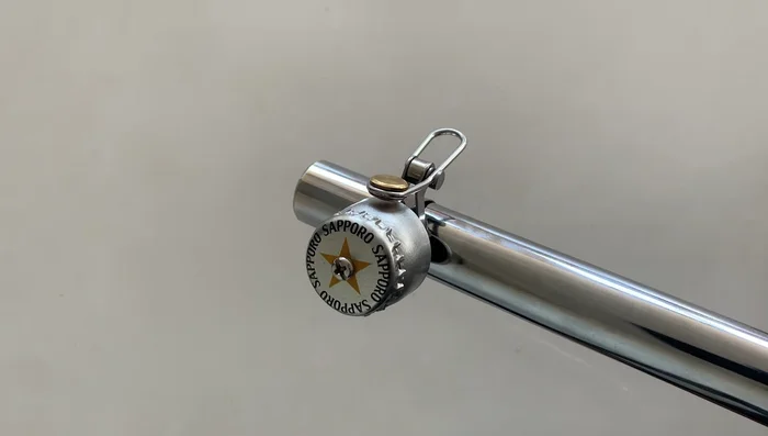 Check that the cap isn't touching the bell; add more spacers if needed.