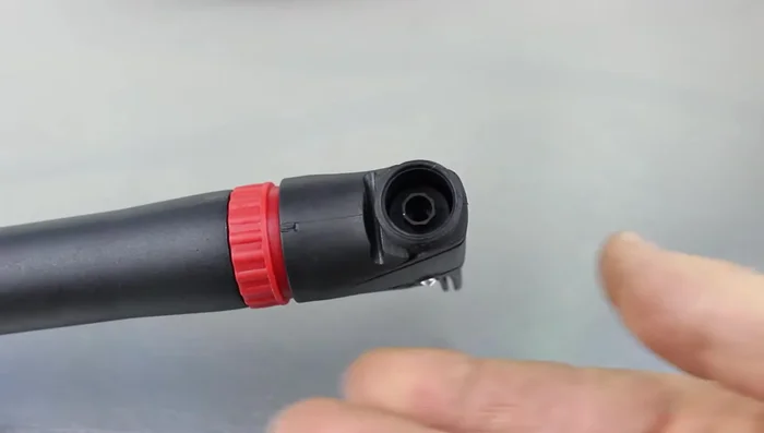 Remove the plastic piece inside the pump head.