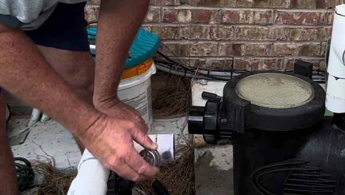 Prime both connections (front and top) with pipe glue primer.