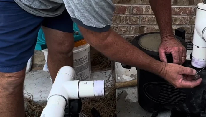 Install the top fitting first, ensuring correct height by pressing it into place and then sliding the pump underneath.