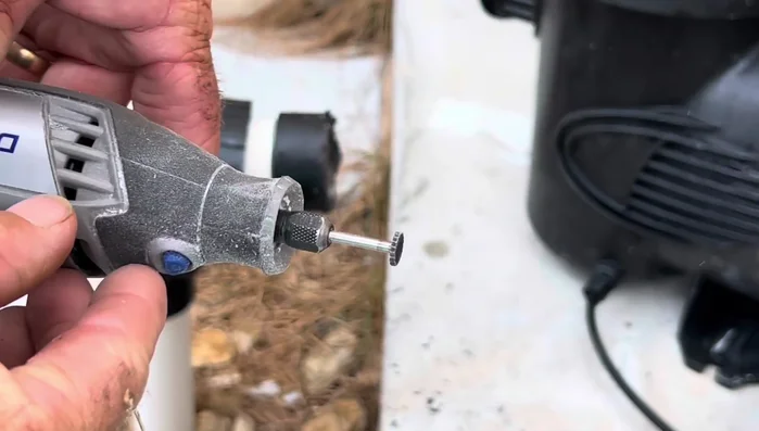 Use a hammer and screwdriver to pry off the cut union piece.