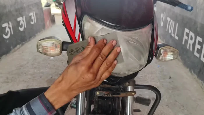 Using 2000mm emery paper (or higher), wet-sand the headlight for at least 5 minutes, continuously adding water to prevent scratches. This removes the yellowed top layer.