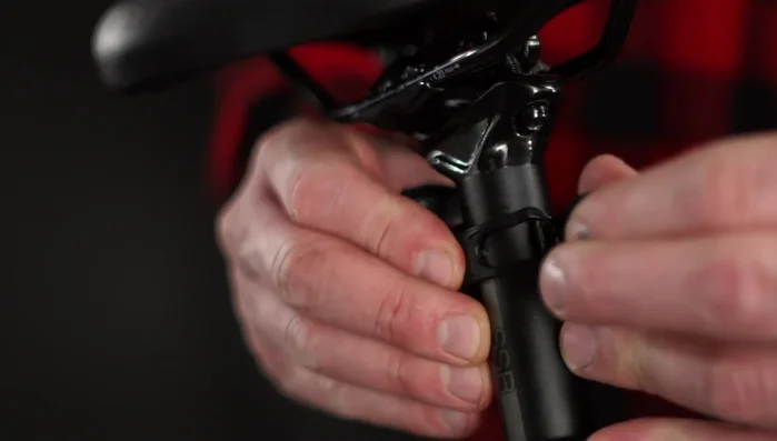 Attach the bracket to your seat post using rubber straps, hooking securely through a notch.