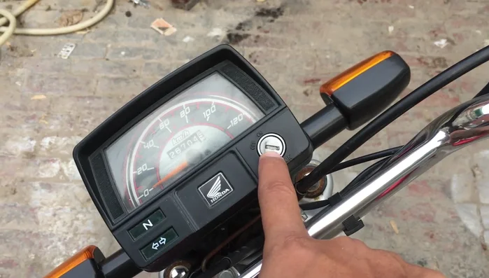 Remove excess water: Gently insert the key and wiggle it to remove any trapped water.