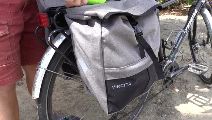 Demonstration of bag capacity with groceries from a farmer's market.