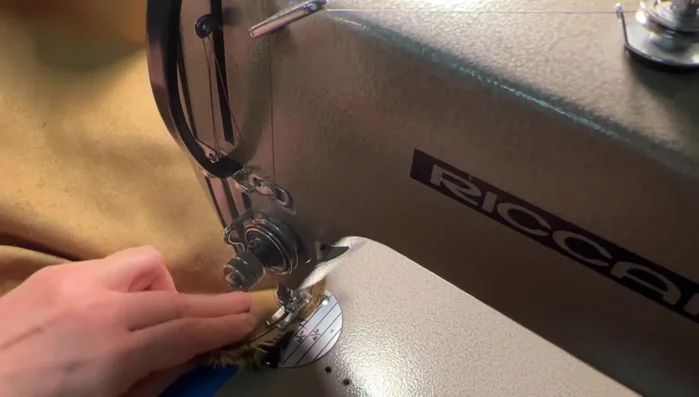 Repeat step 6, creating a second stitch line about ⅛ inch from the first new stitch line for reinforcement. Pay extra attention to smoothing out the fabric around any bumps or pleats.