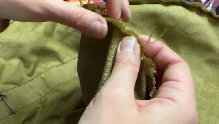 Set up your sewing machine with heavy-duty nylon thread and a larger needle (size 1108 recommended). Adjust tension as needed for the thicker thread.