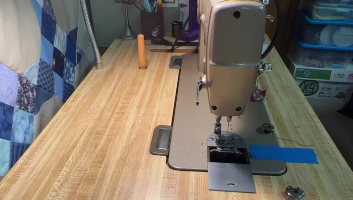 Set up your sewing machine with heavy-duty nylon thread and a larger needle (size 1108 recommended). Adjust tension as needed for the thicker thread.