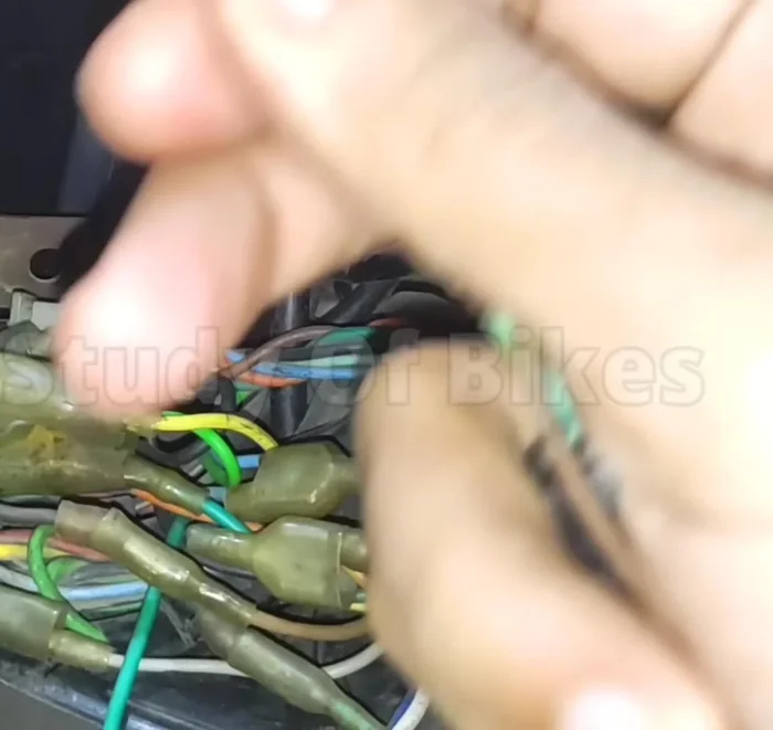 Route the other end of the extra wire to the headlight switch assembly.