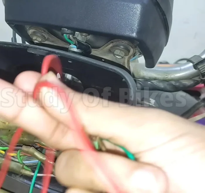 Route the other end of the extra wire to the headlight switch assembly.