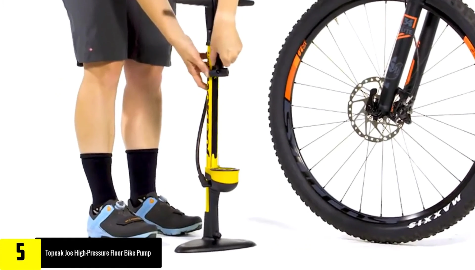 User demonstrating the long hose of the Topeak Joe pump