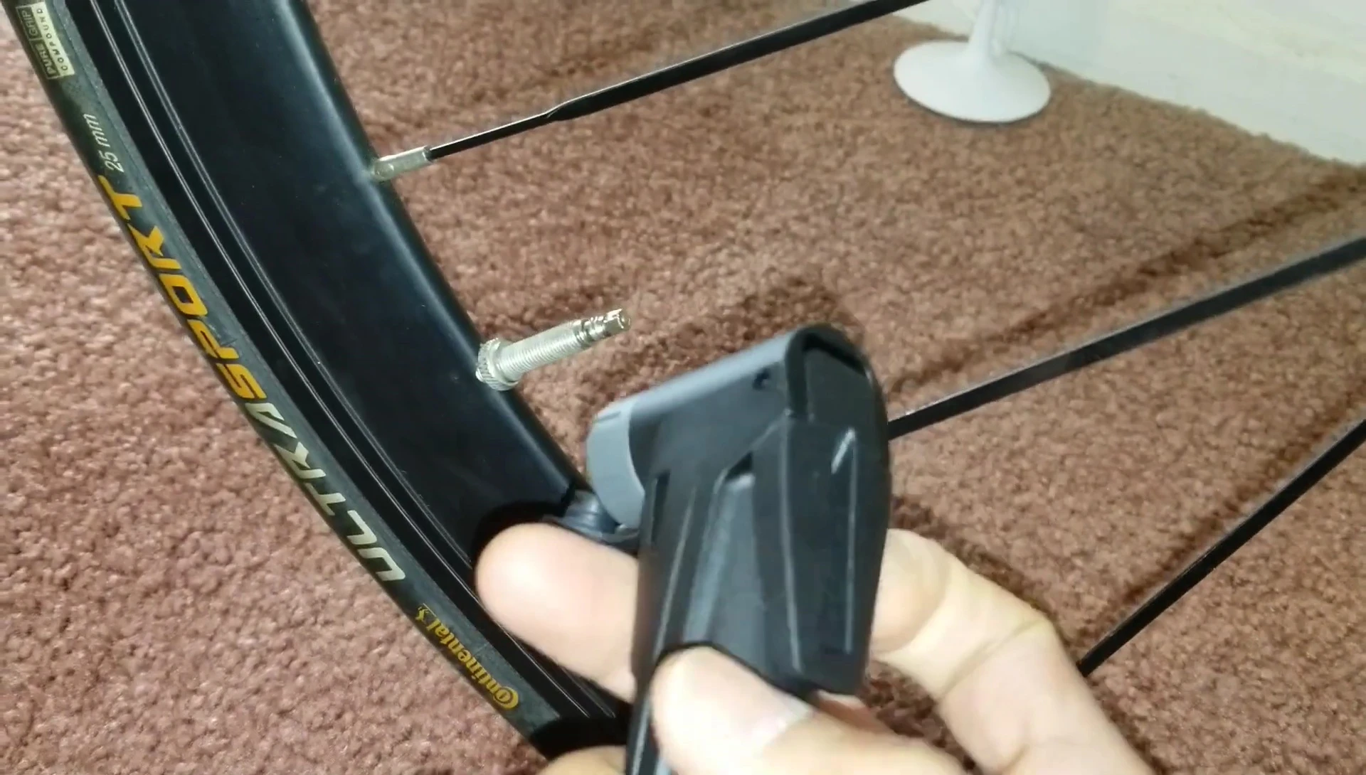 Attaching the adapter and starting the inflation process.