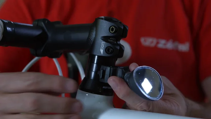 Lock it with the elastic collar.