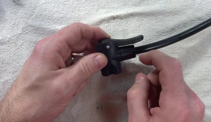 Replace any worn O-rings around the Schrader and Presta valve parts, and the rubber ball and top part. Reassemble the pump head in reverse order.