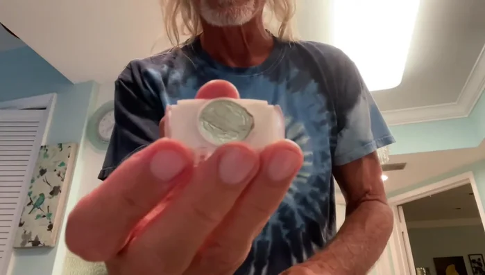 Pull off the light casing. This might require a small screwdriver (as shown in the video, starting at 48.719 seconds).