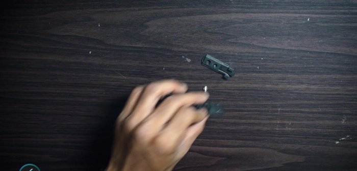 Pass a cable tie through the hole and tighten it, leaving a small gap.