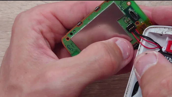 Connect the new battery connector to the motherboard.