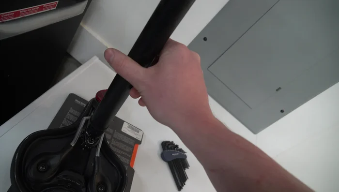 Attach the new seat to the rails and tighten the screws. 