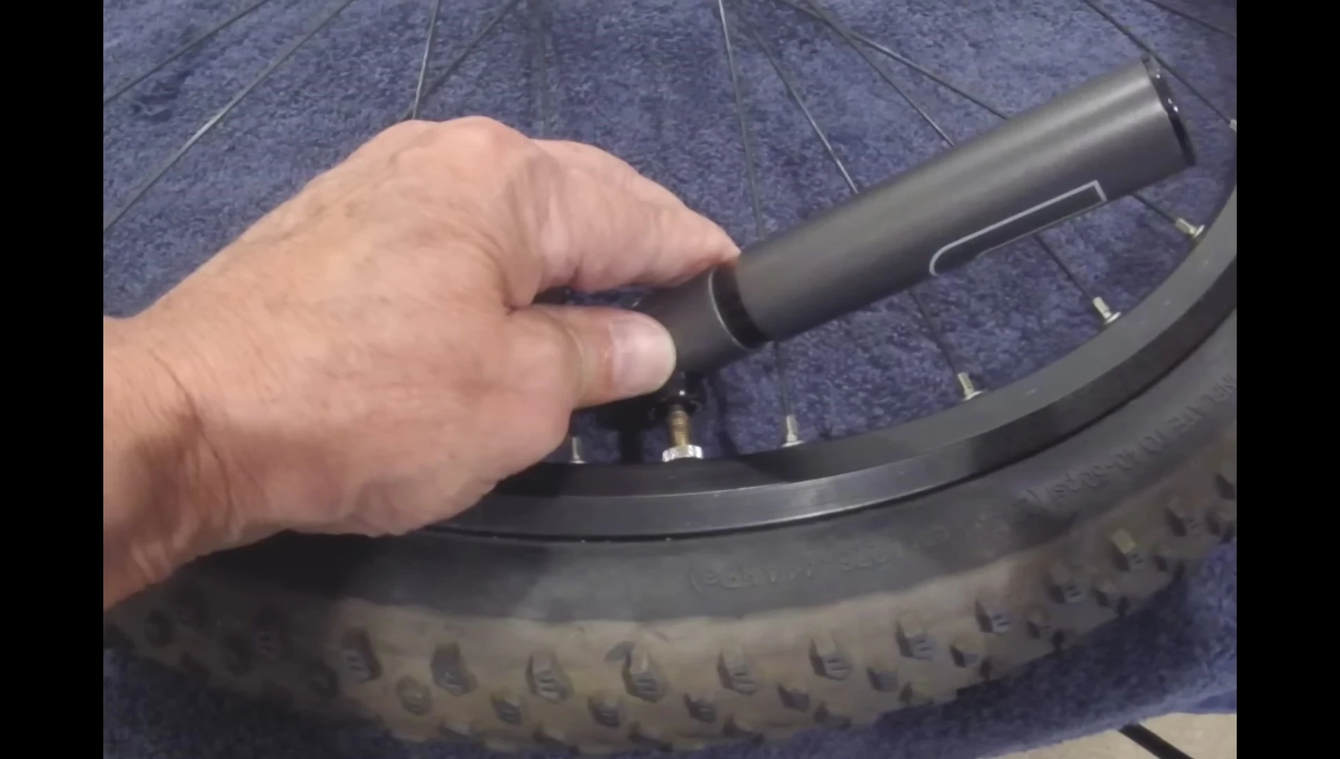 Pumping the tire with the GIYO Super Micro MTB pump.