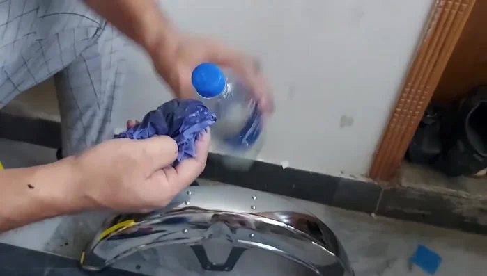Clean any excess paint using petrol and a cloth.