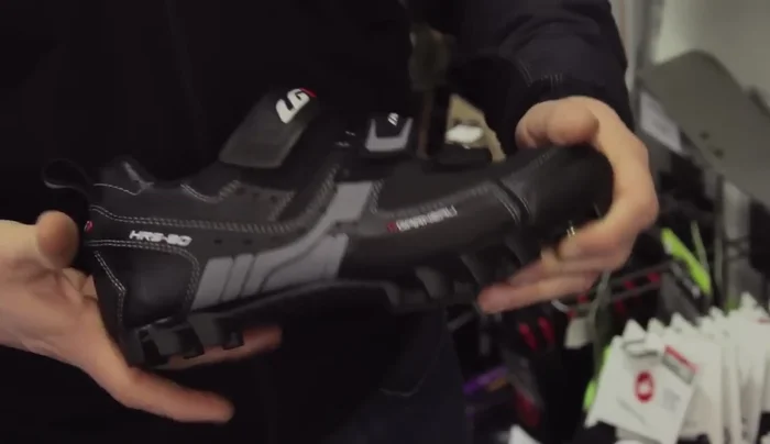 Select mountain bike shoes with a stiff sole for efficient power transfer and large lugs for grip in off-road conditions.