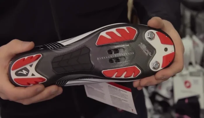 Consider high-end mountain bike shoes with a carbon fiber sole for increased stiffness and lightweight performance. Look for features like well-ventilated uppers, bolt holes for studs, and a ratchet mechanism for a precise fit.