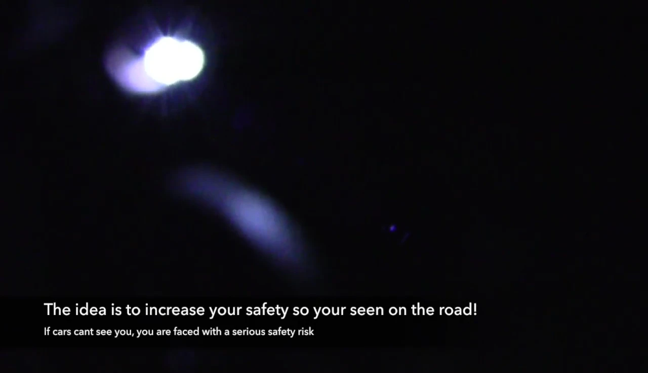 The lights mounted to the seat bag in a low light setting