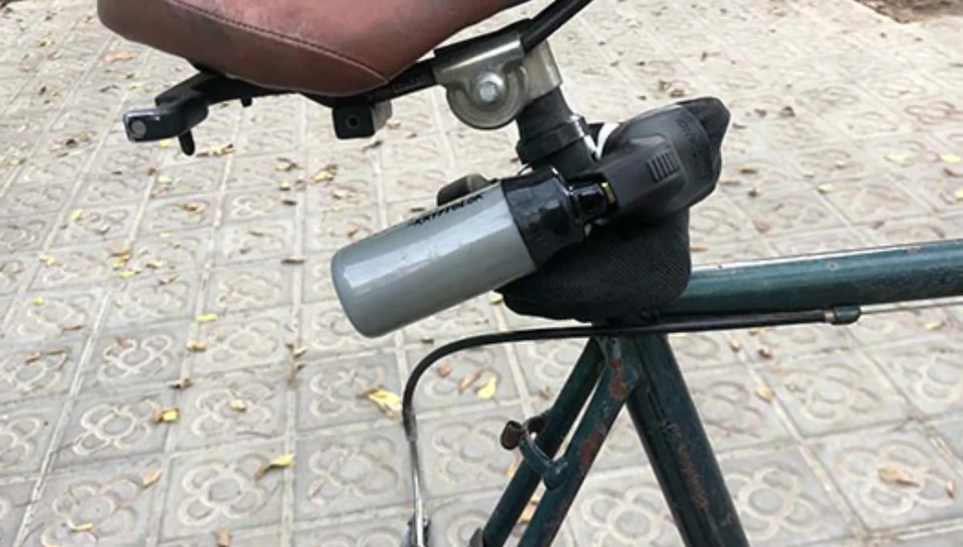The lock secured around the bicycle's seat post.