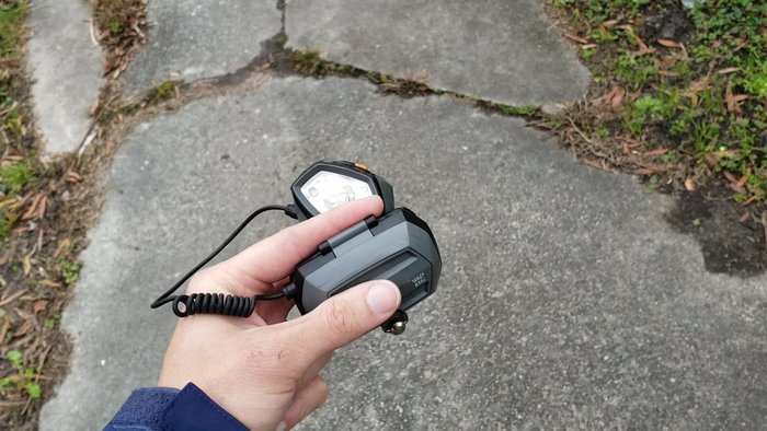 Strip the wiring of both the bike light and the microUSB cable.