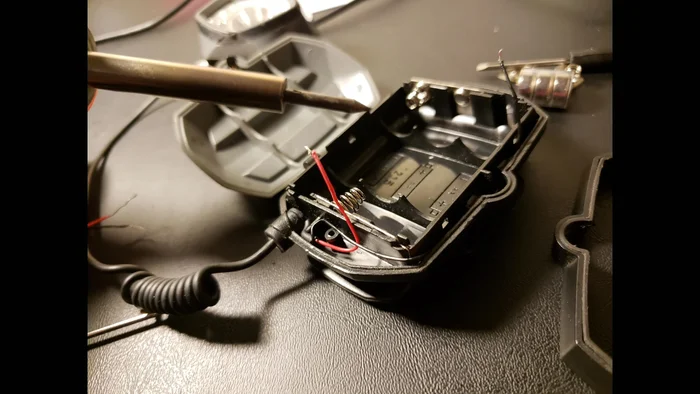 Strip the wiring of both the bike light and the microUSB cable.