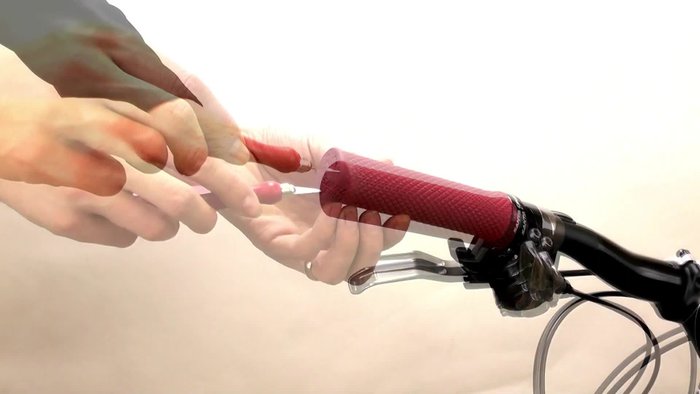 Use a sharp knife to poke through and cut around the inside of the handlebar grip.