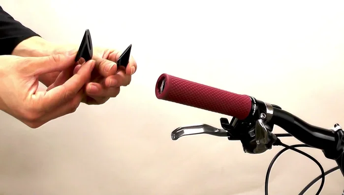 Insert the long bolt through the mirror base and wedge, then screw it into the barrel nut. Pull the wedge onto the barrel nut to secure.