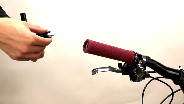 Insert the long bolt through the mirror base and wedge, then screw it into the barrel nut. Pull the wedge onto the barrel nut to secure.