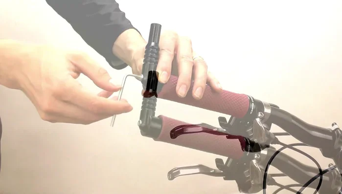 Add a large washer to the cap screw and screw it into the mirror base, tightening with the hex wrench.