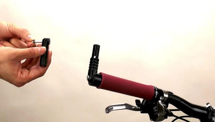 Add a large washer to the cap screw and screw it into the mirror base, tightening with the hex wrench.