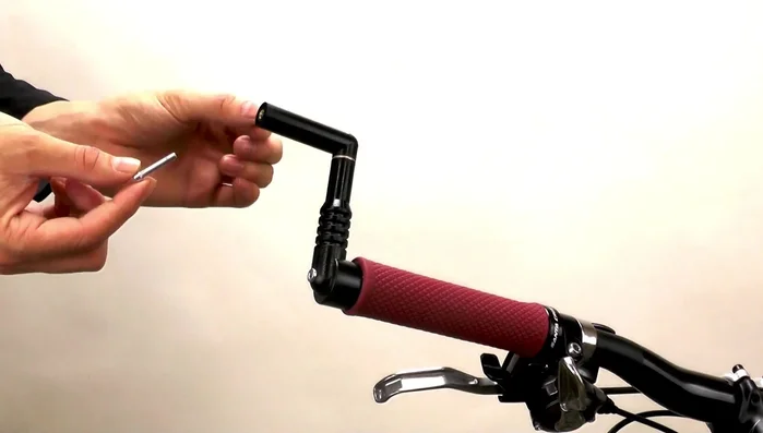 Add a large washer to this cap screw, screw it into the mirror arm, and tighten with the hex wrench.