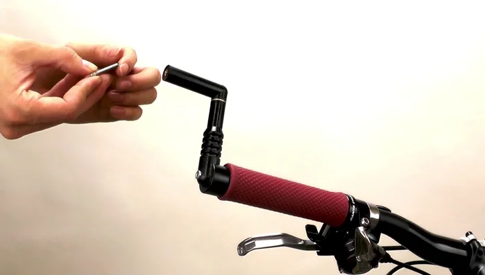 Add a large washer to this cap screw, screw it into the mirror arm, and tighten with the hex wrench.