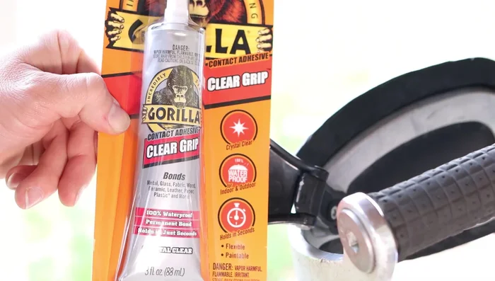 Apply Gorilla contact adhesive to the edges of the mirror assembly.
