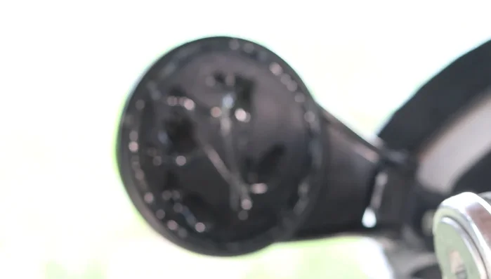 Insert the mirror glass into the assembly and secure it with clamps.