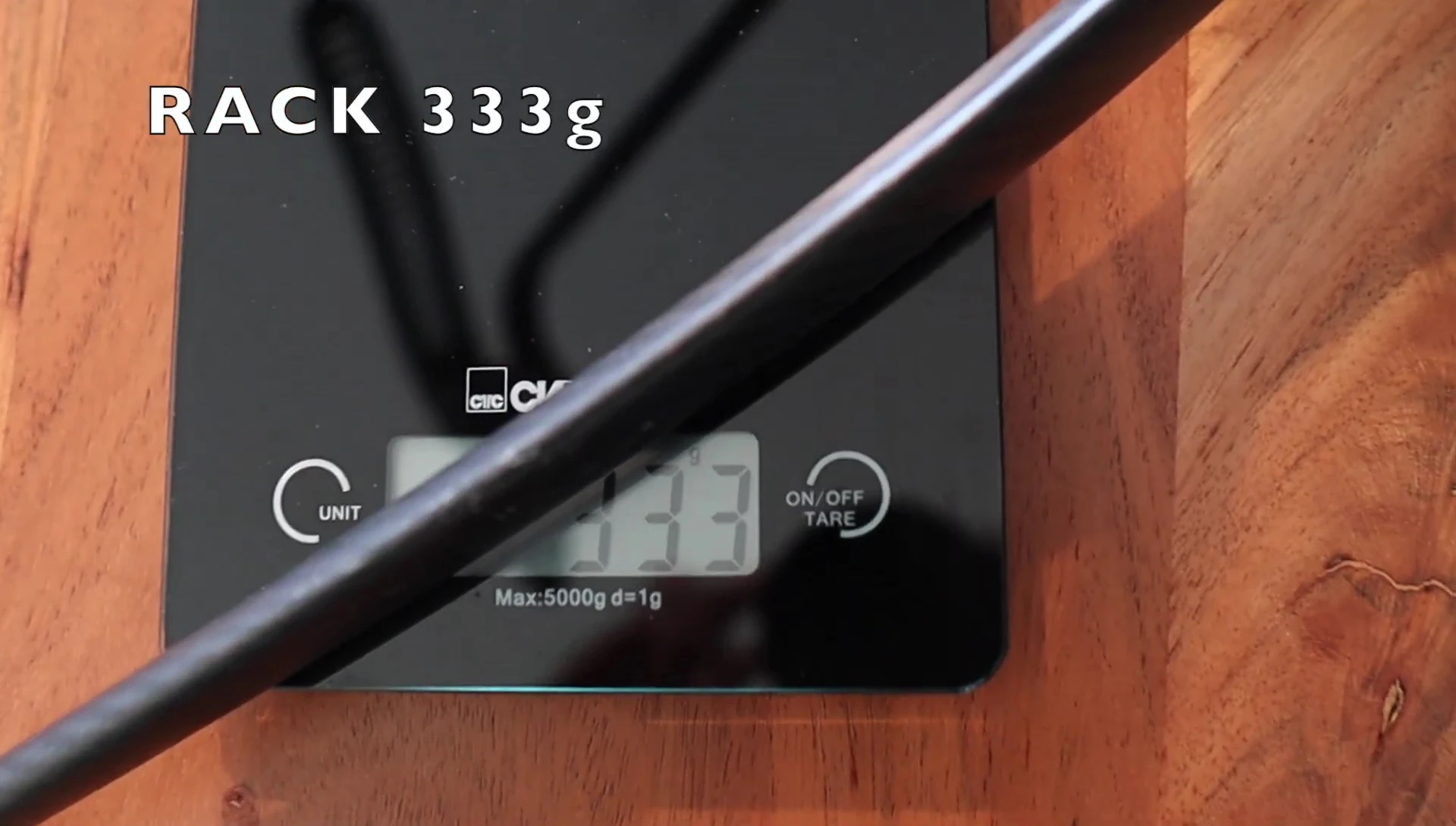 Close-up of Tailfin Aero Pack components showing weight and size