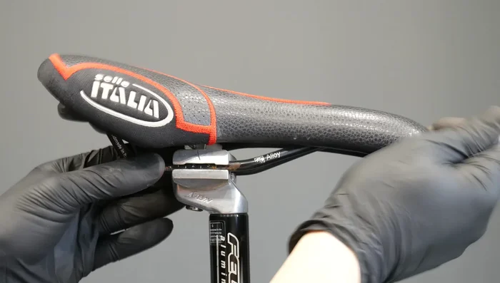 Adjust the saddle angle and position using the bolt and the built-in adjustment mechanism.