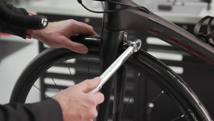 Torque the fork crown fastener to a max of 5.2 Newton meters and the strut hardware to 3 Newton meters.