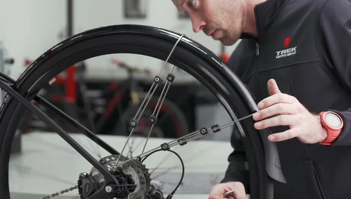 Reinstall the rear wheel and adjust the rear fender for proper clearance.