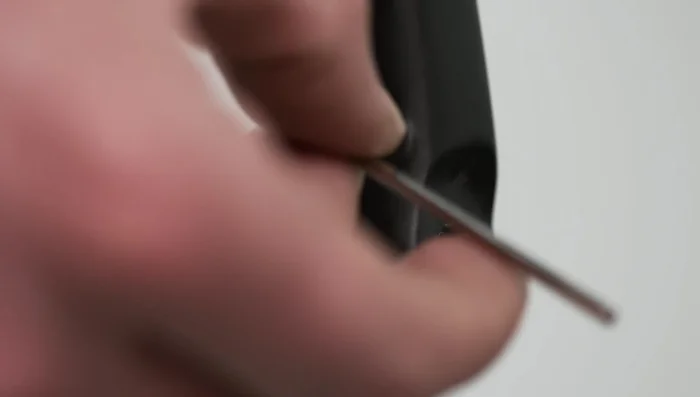 Remove the vanishing fender mount set screws from the fork legs.